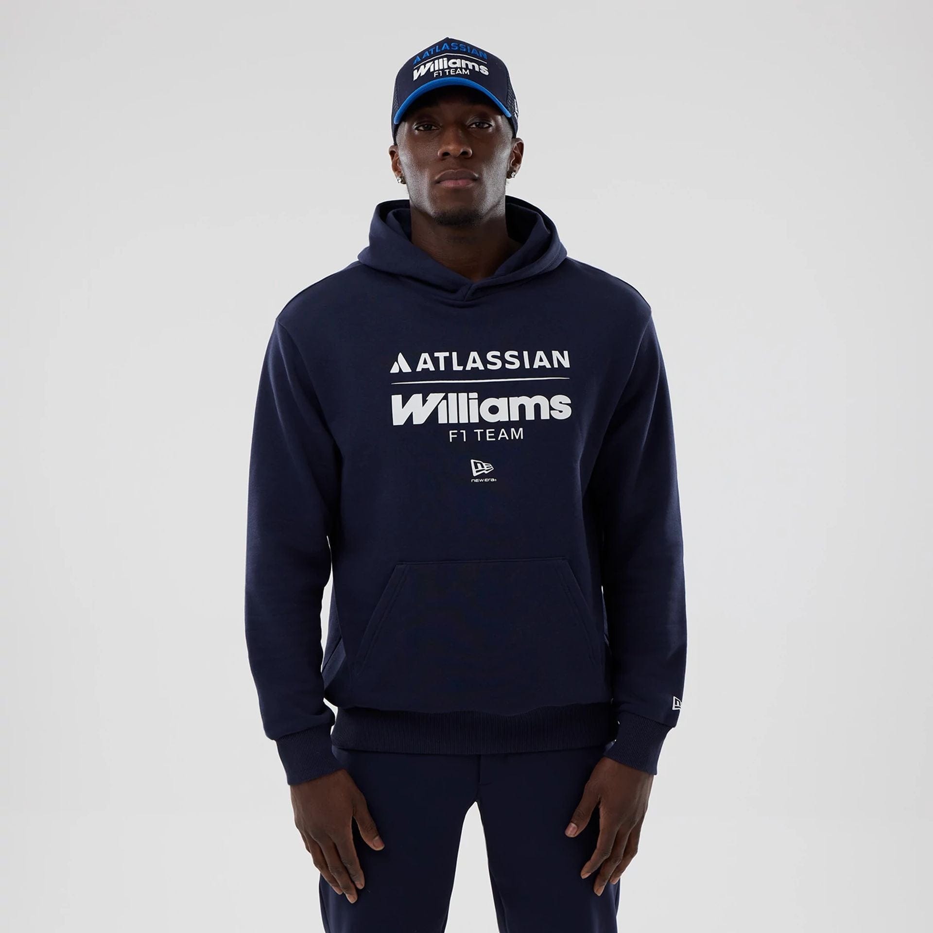 The model is wearing this Atlassian Williams F1 Team Oversized Pullover Hoodie in navy. 1