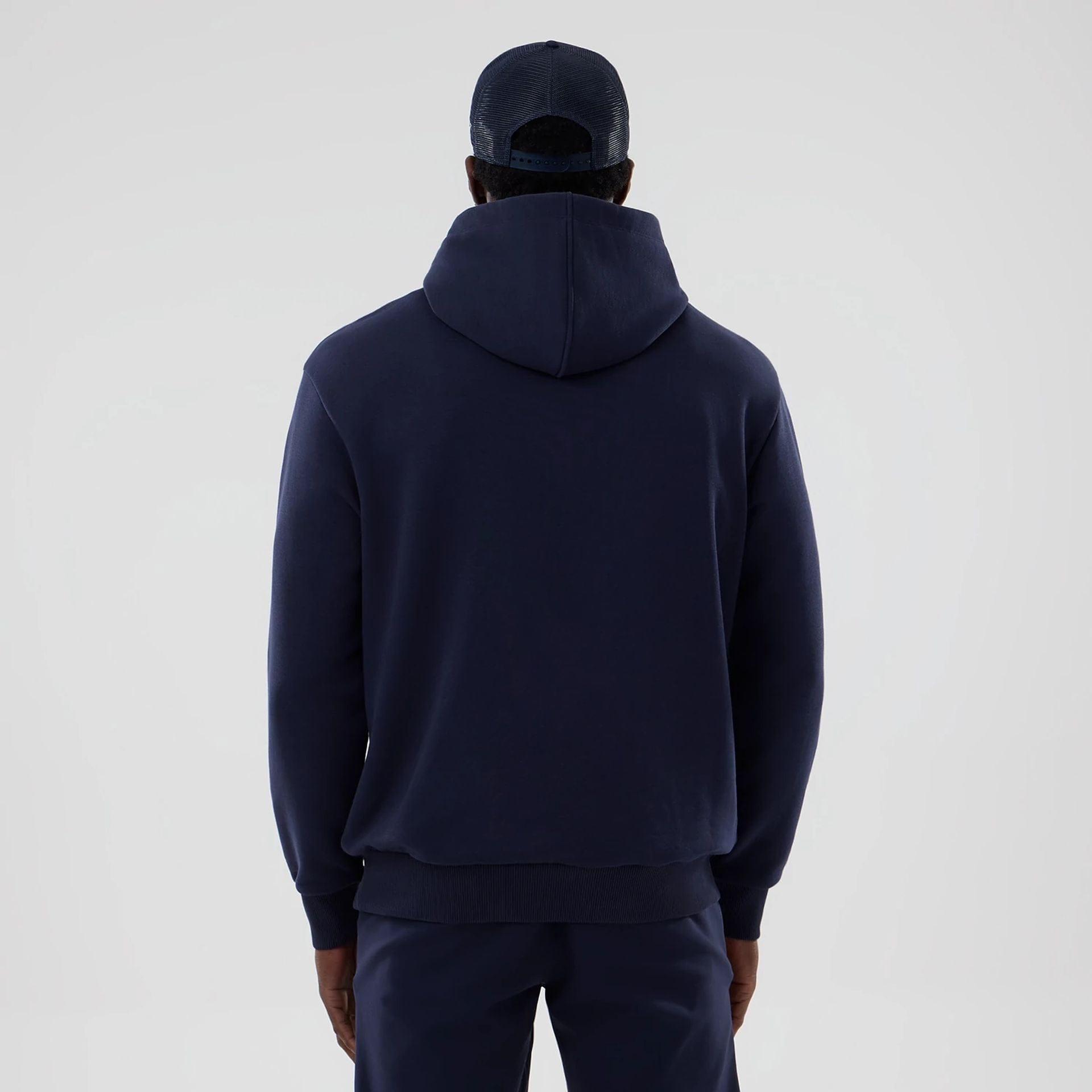 The model is wearing this Atlassian Williams F1 Team Oversized Pullover Hoodie in navy. 2