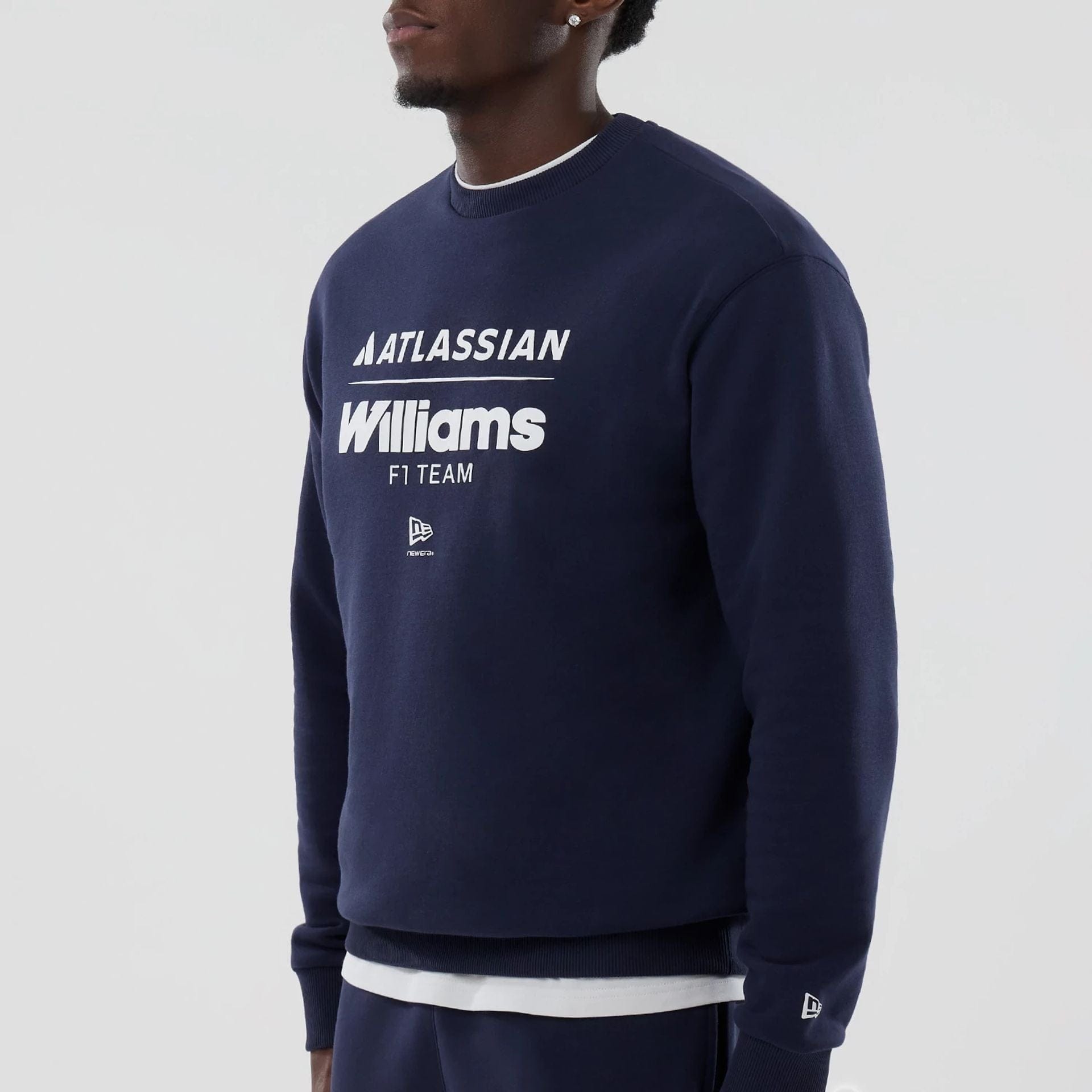 The model is wearing this Atlassian Williams F1 Team Oversized Crew Neck Sweater in navy. 4