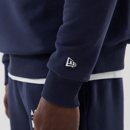 The model is wearing this Atlassian Williams F1 Team Oversized Crew Neck Sweater in navy. 5