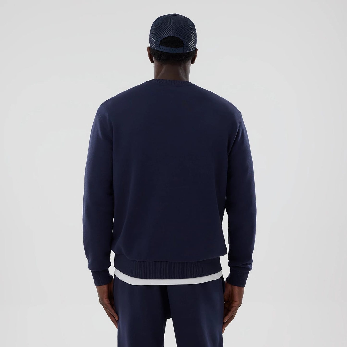 The model is wearing this Atlassian Williams F1 Team Oversized Crew Neck Sweater in navy. 2
