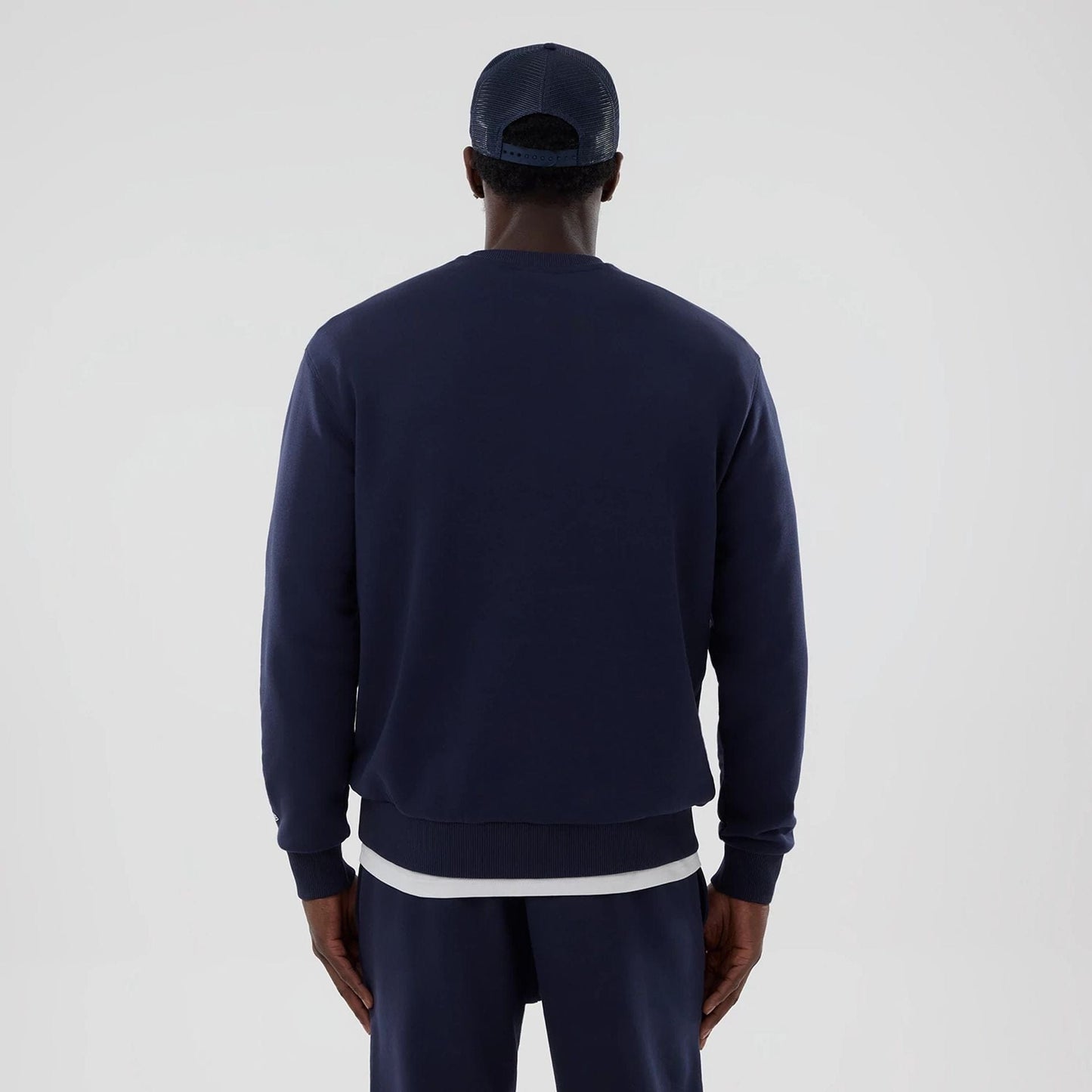 The model is wearing this Atlassian Williams F1 Team Oversized Crew Neck Sweater in navy. 2