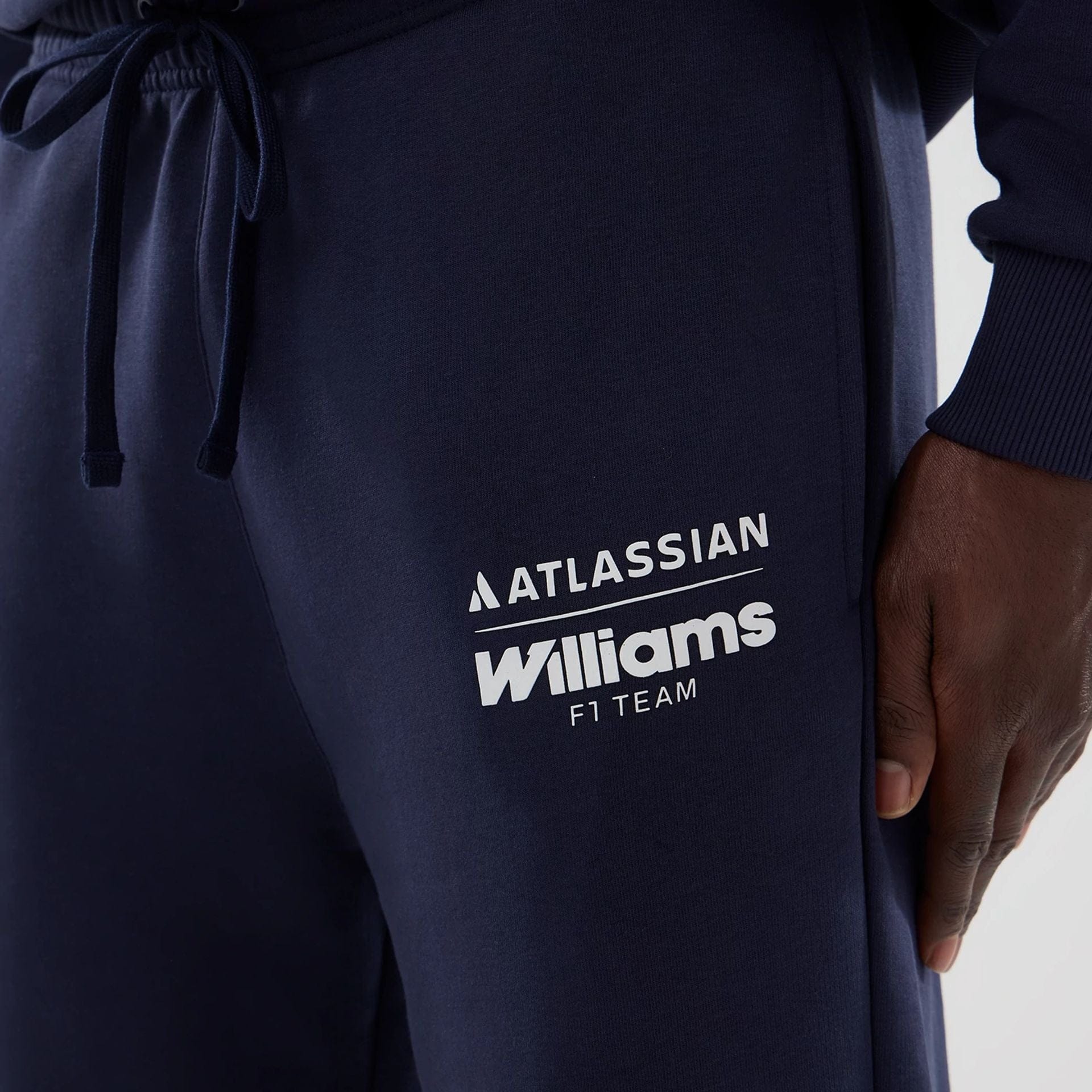 The model is wearing these Atlassian Williams F1 Team Joggers in navy. 2