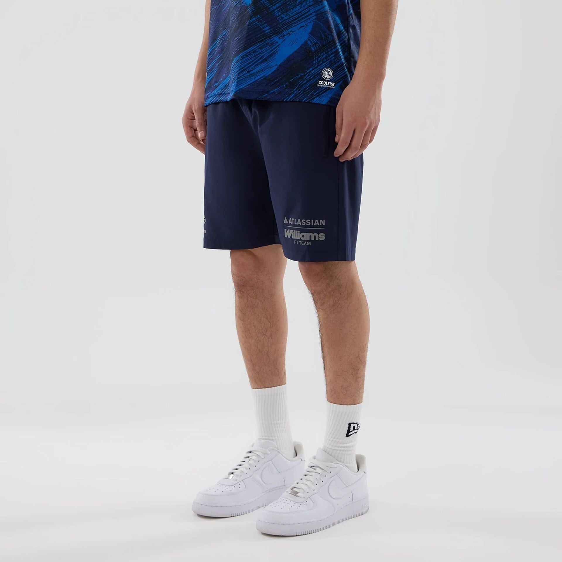 The model is wearing these Atlassian Williams F1 Team Training Shorts in navy. 4