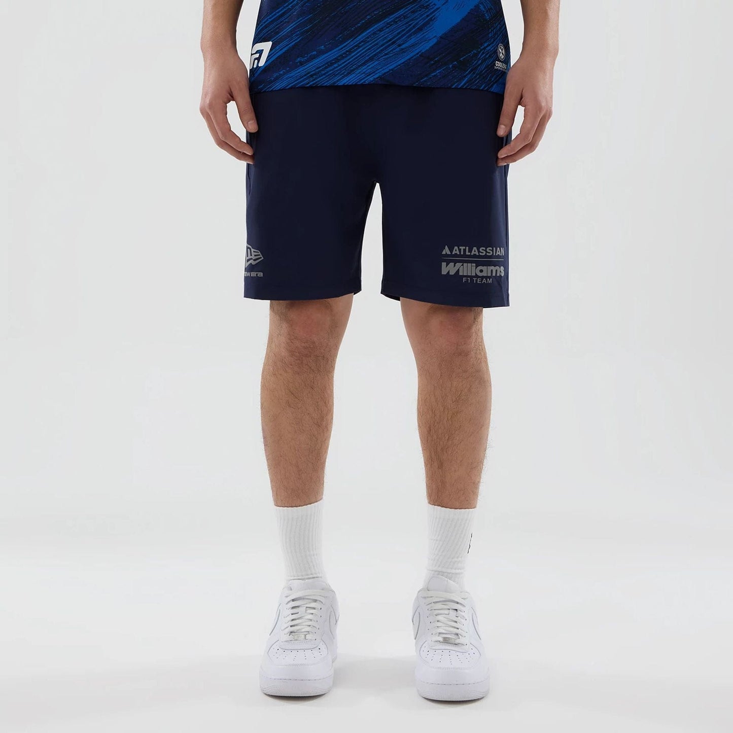 The model is wearing these Atlassian Williams F1 Team Training Shorts in navy. 1