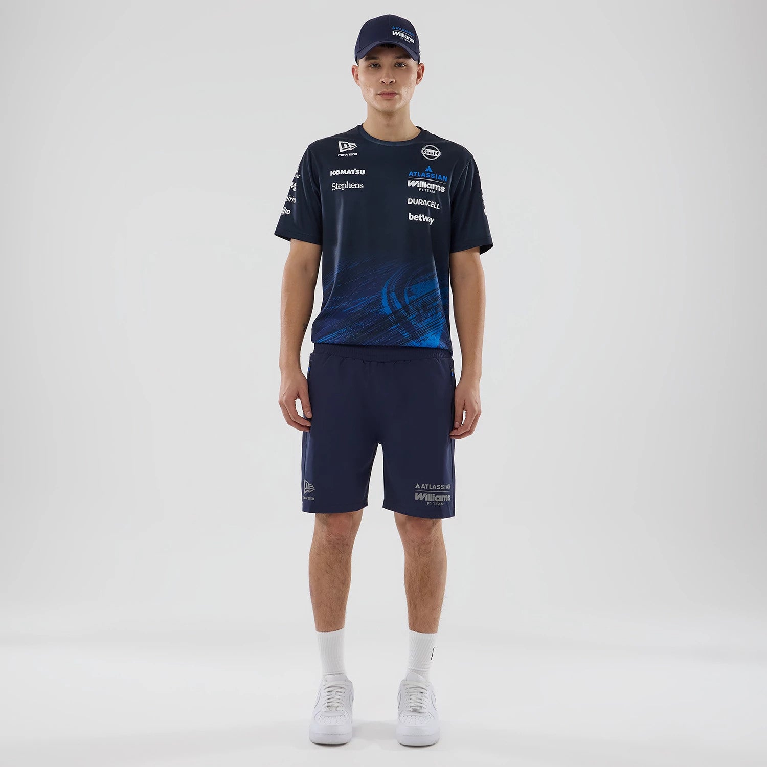 The model is wearing these Atlassian Williams F1 Team Training Shorts in navy. 6
