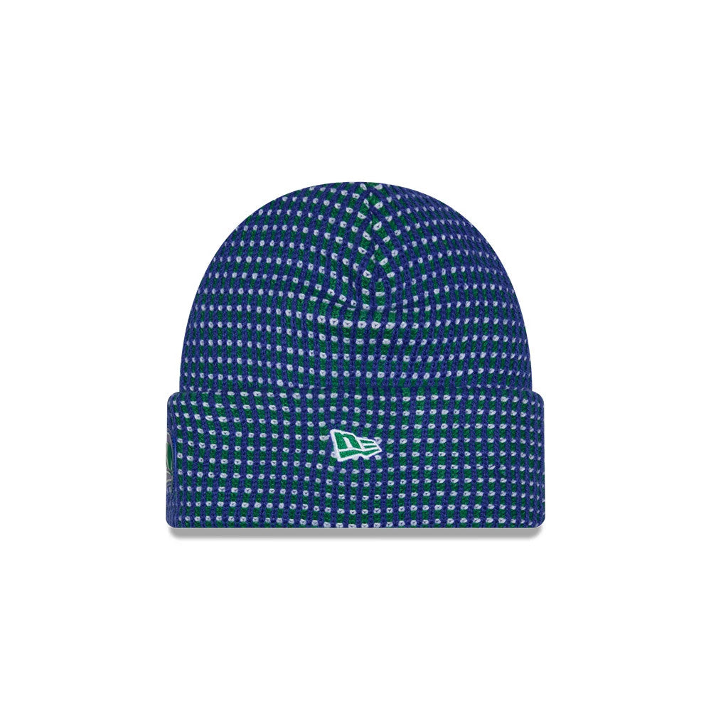 New Era Seattle Seahawks NFL Sideline 2026 Blue Cuff Knit Beanie Hat, front view showing a patterned blue and green grid texture, with the white embroidered New Era flag logo centred on the front cuff, highlighting its cosy cuffed design.
