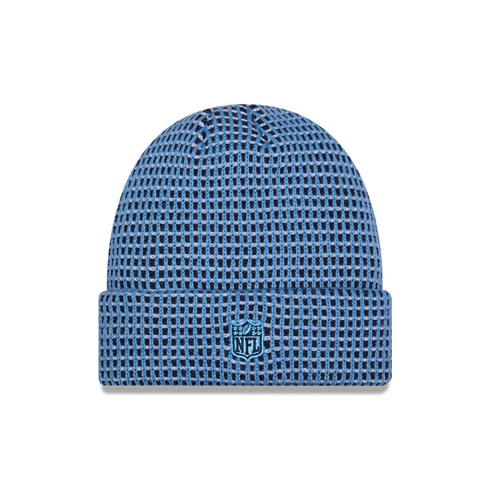 New Era Tennessee Titans NFL Sideline 2026 Blue & Black Cuff Knit Beanie Hat, front view showing the light blue and black grid pattern knit fabric, with an embroidered blue NFL shield logo on the cuff, and a rounded crown.