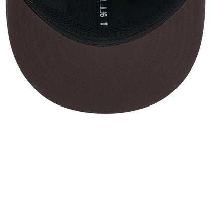 Browns NFL Sideline 2026 Charcoal New Era 9FIFTY Snapback Adjustable Cap, inside view showcasing a black sweatband against the dark charcoal undervisor, with a 9FIFTY design label along the inner band.