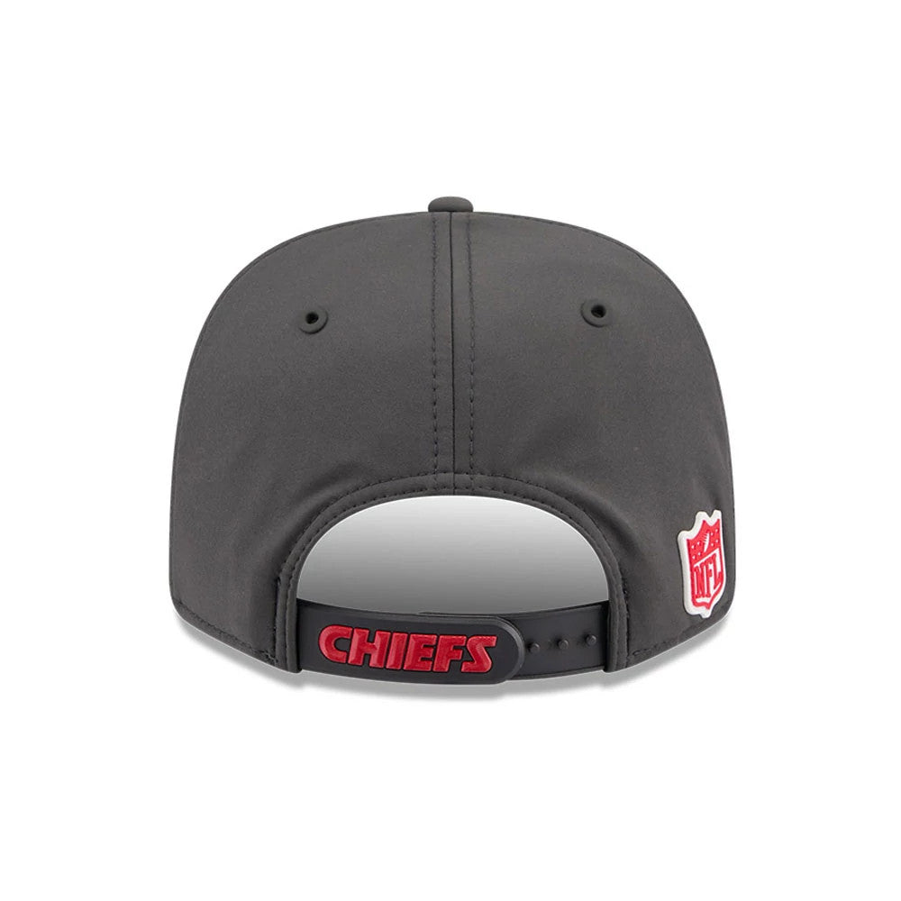 Chiefs NFL Sideline 2026 Charcoal New Era 9SEVENTY Stretch Snap Adjustable Cap, rear view showing an embroidered NFL shield logo on the right side and red CHIEFS lettering across the black adjustable snapback strap.