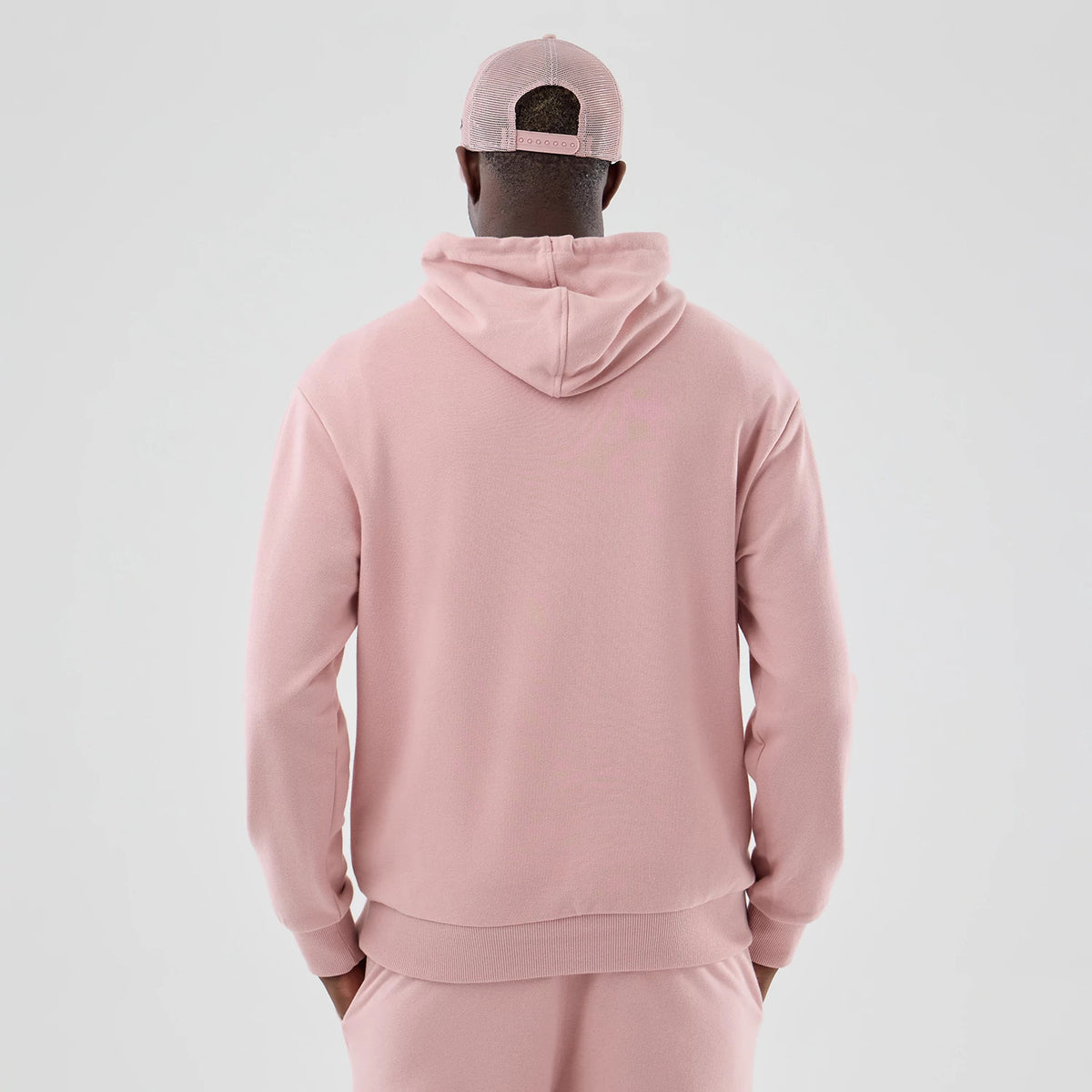 The model is wearing this MLB Midi League Essential LA Dodgers Oversized Pullover Hoodie in pastel pink. 2