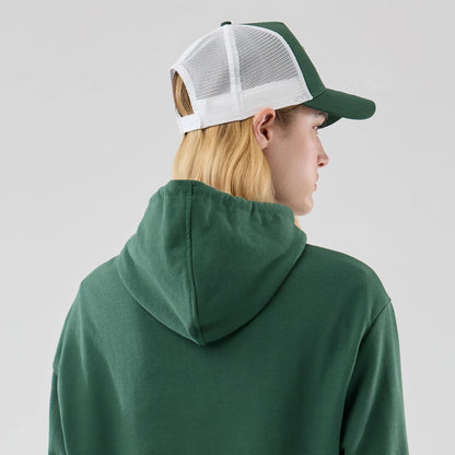 The model is wearing this MLB Midi League Essential New York Yankees Oversized Pullover Hoodie in dark green. 8