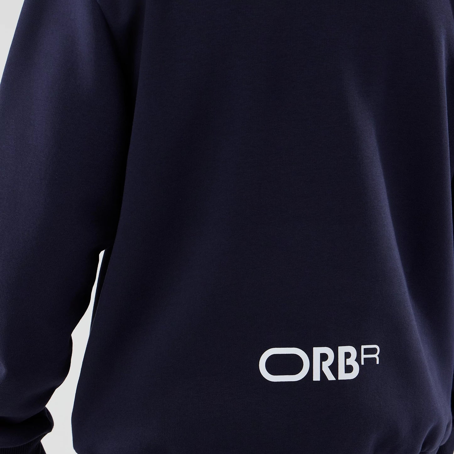 The model is wearing this Red Bull Racing Oversized Crew Neck Sweater in dark blue. 5