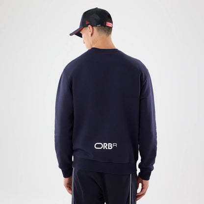 The model is wearing this Red Bull Racing Oversized Crew Neck Sweater in dark blue. 2