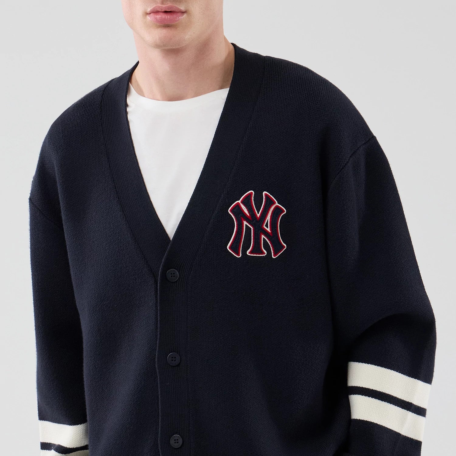 The model is wearing this MLB Knit New York Yankees Cardigan in navy. 3