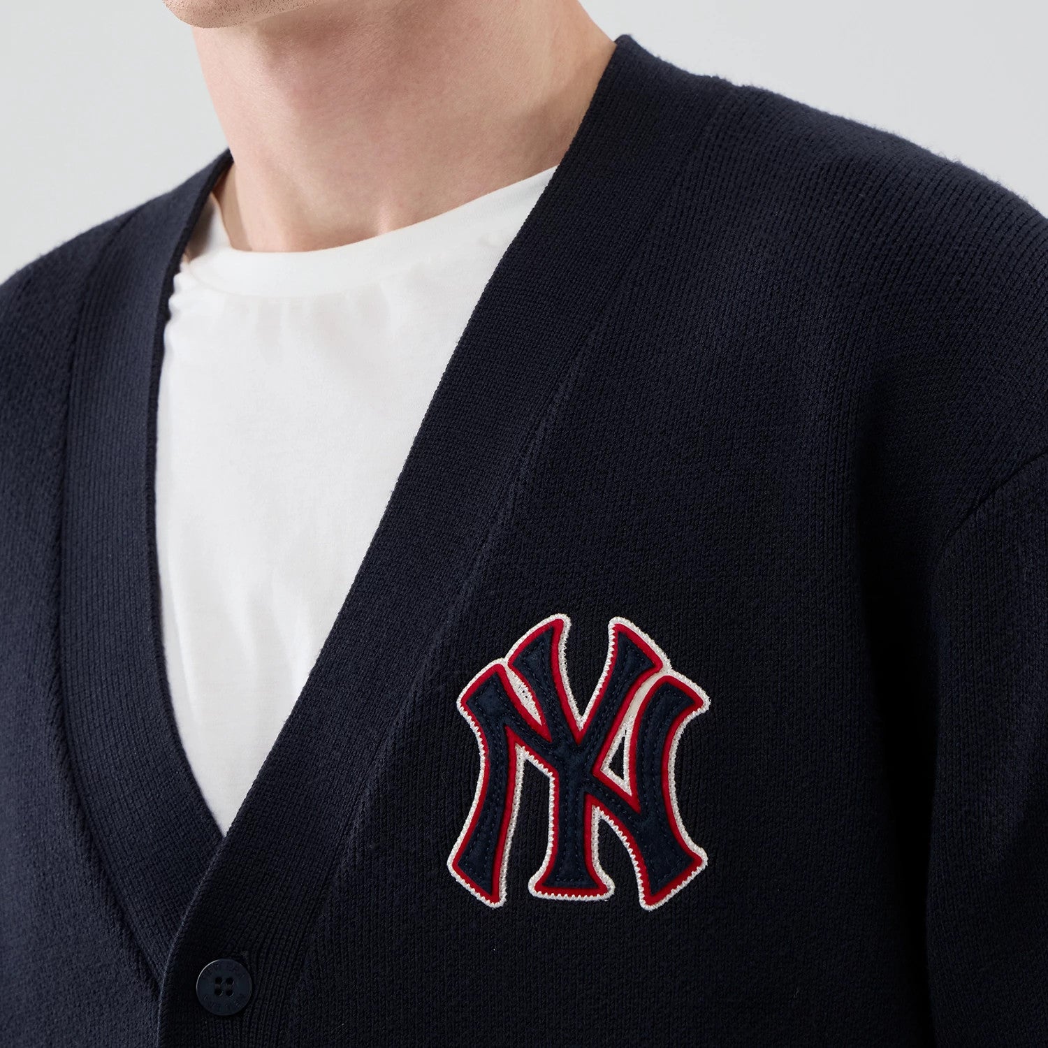 The model is wearing this MLB Knit New York Yankees Cardigan in navy. 4