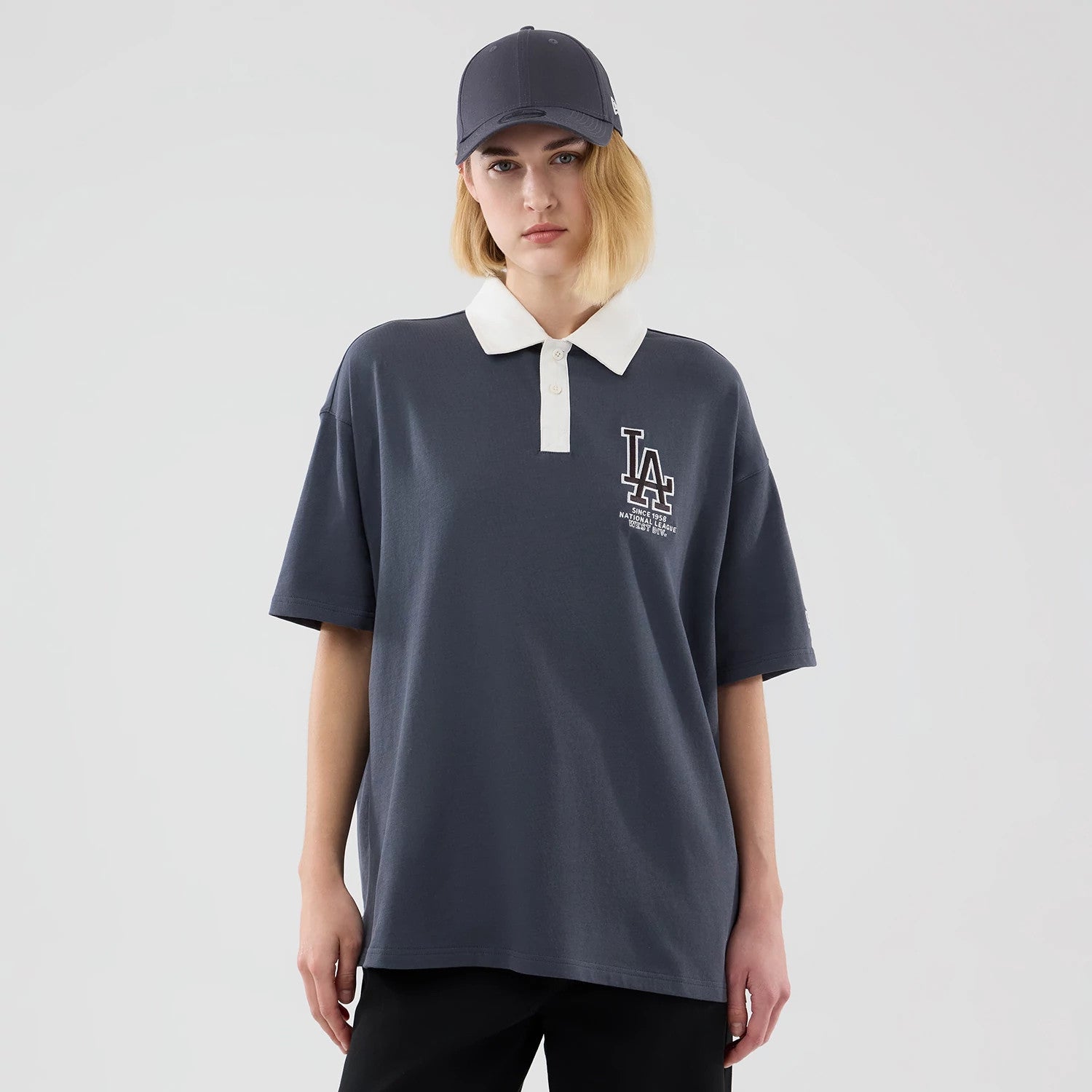 The model is wearing this MLB LA Dodgers Polo T-Shirt in grey. 4