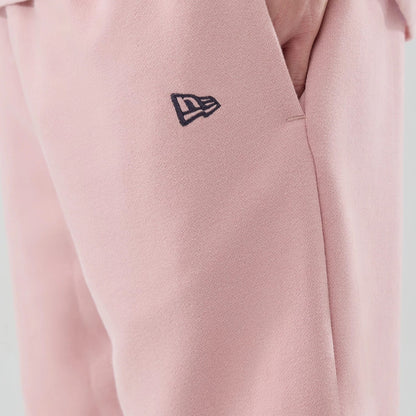 The model is wearing these MLB Midi League Essential LA Dodgers Oversized Shorts in pastel pink. 5