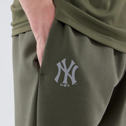 The model is wearing these MLB Core Plus New York Yankees Joggers in green. 7