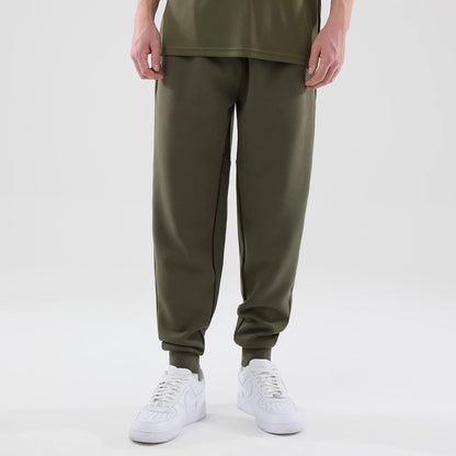 The model is wearing these MLB Core Plus New York Yankees Joggers in green. 1