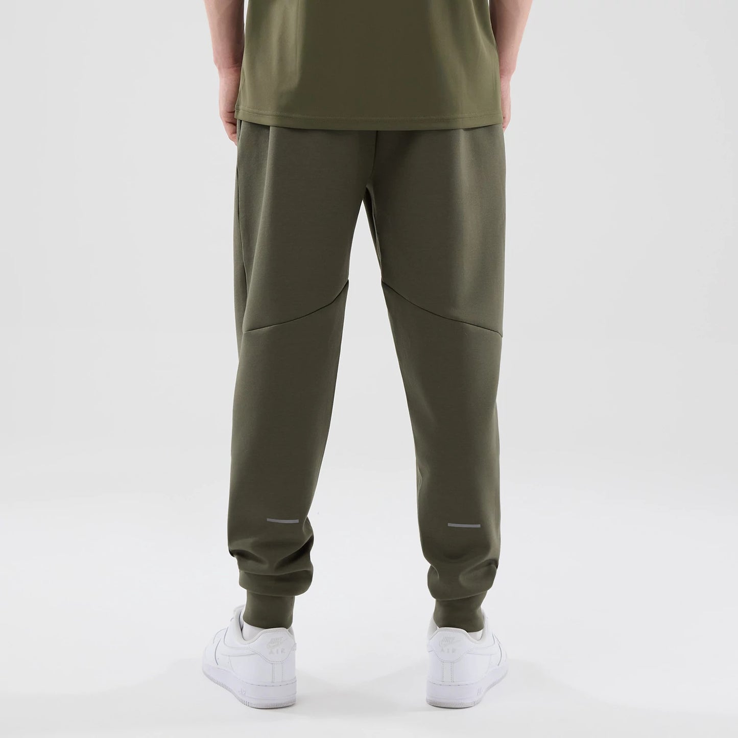 The model is wearing these MLB Core Plus New York Yankees Joggers in green. 2