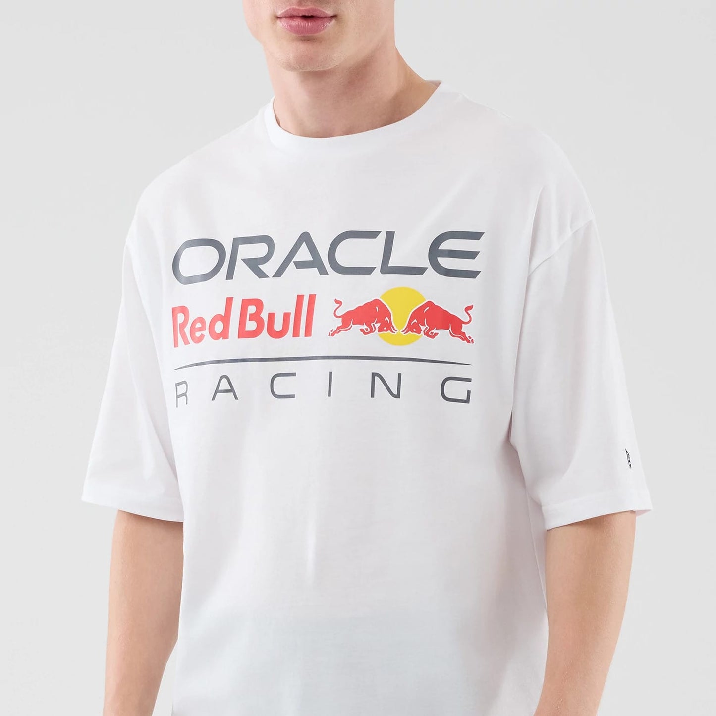 The model is wearing this Red Bull Racing Graphic Oversized T-Shirt in white. 3