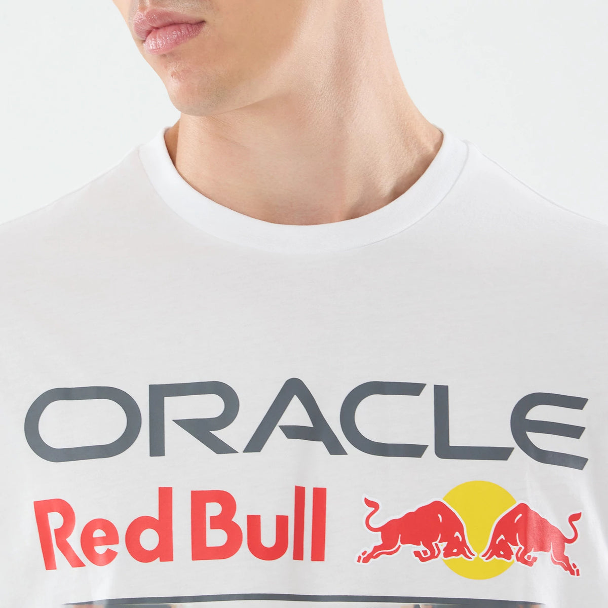 The model is wearing this Red Bull Racing Graphic Oversized T-Shirt in white. 4