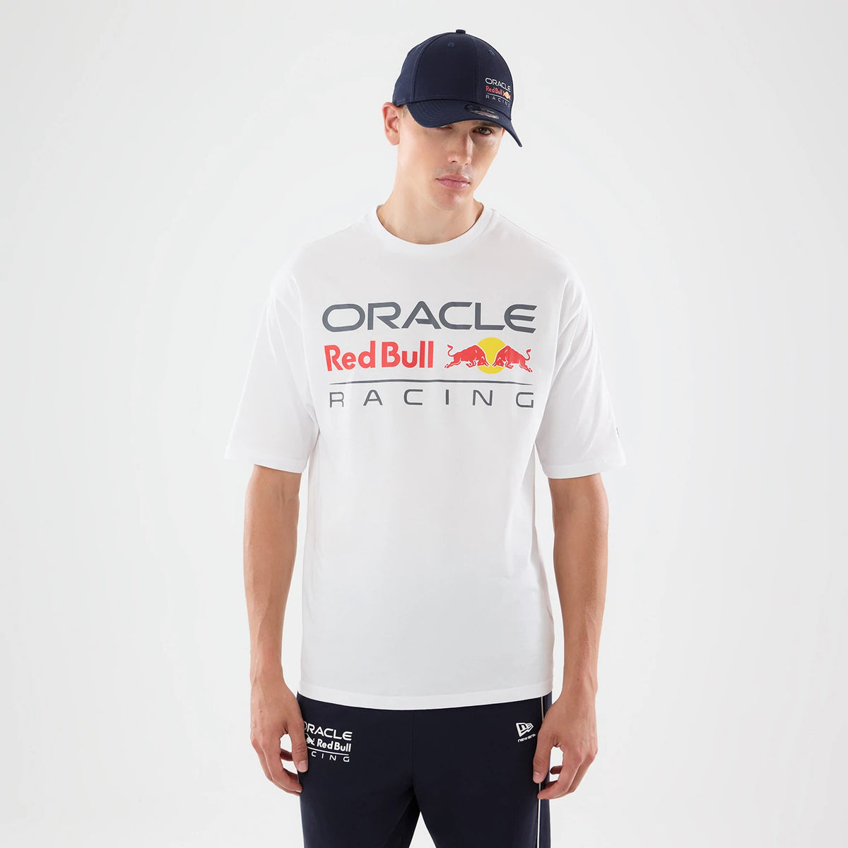 The model is wearing this Red Bull Racing Graphic Oversized T-Shirt in white. 1