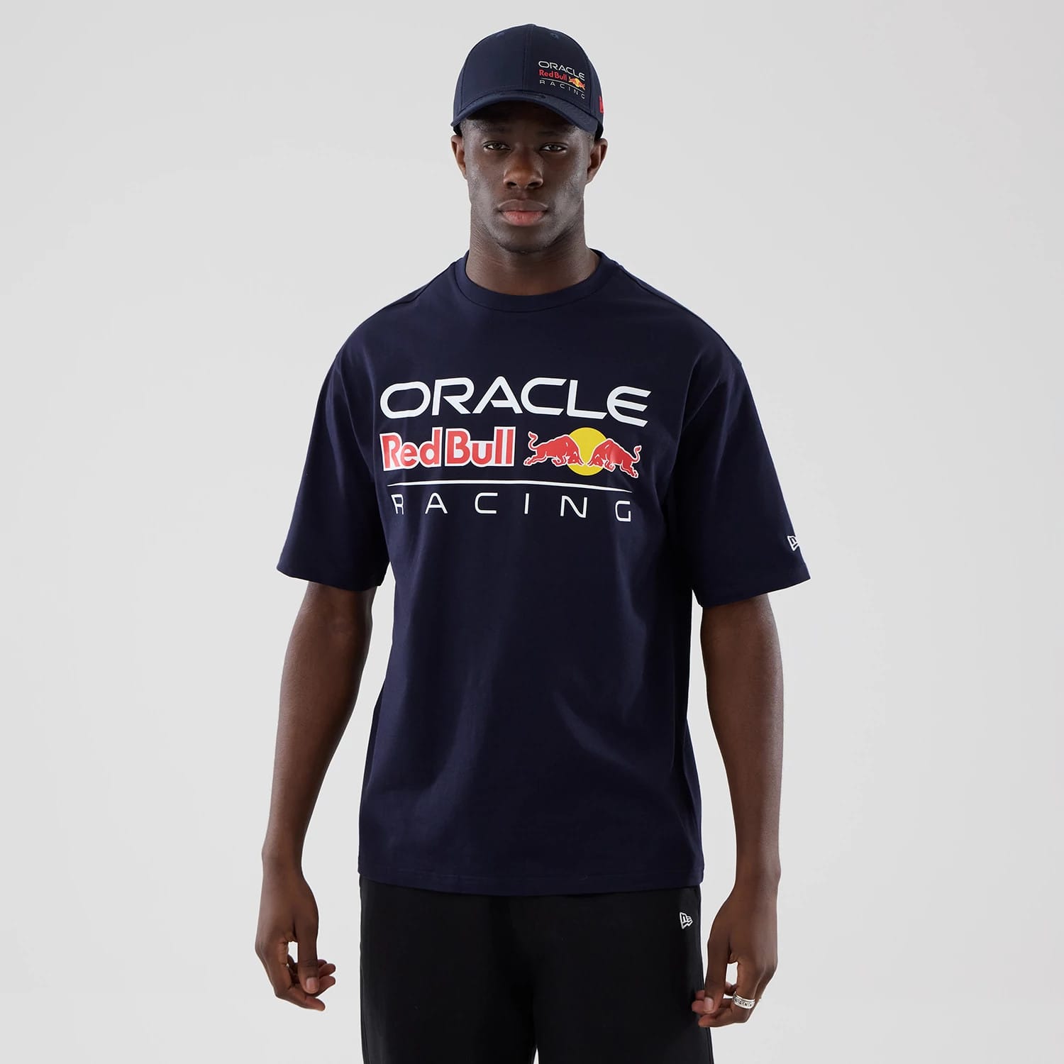 The model is wearing this Red Bull Racing Graphic Oversized T-Shirt in dark blue. 1