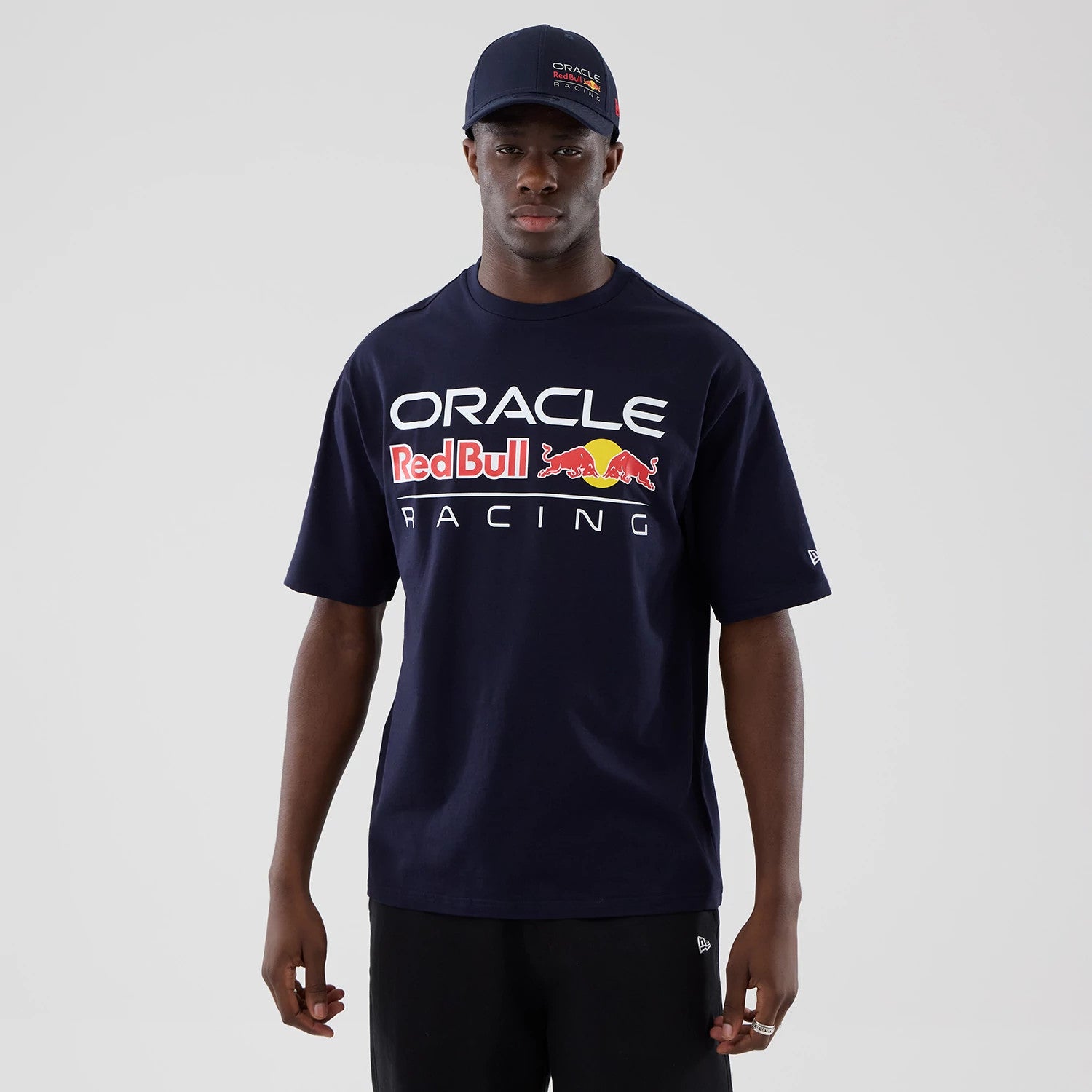 The model is wearing this Red Bull Racing Graphic Oversized T-Shirt in dark blue. 1
