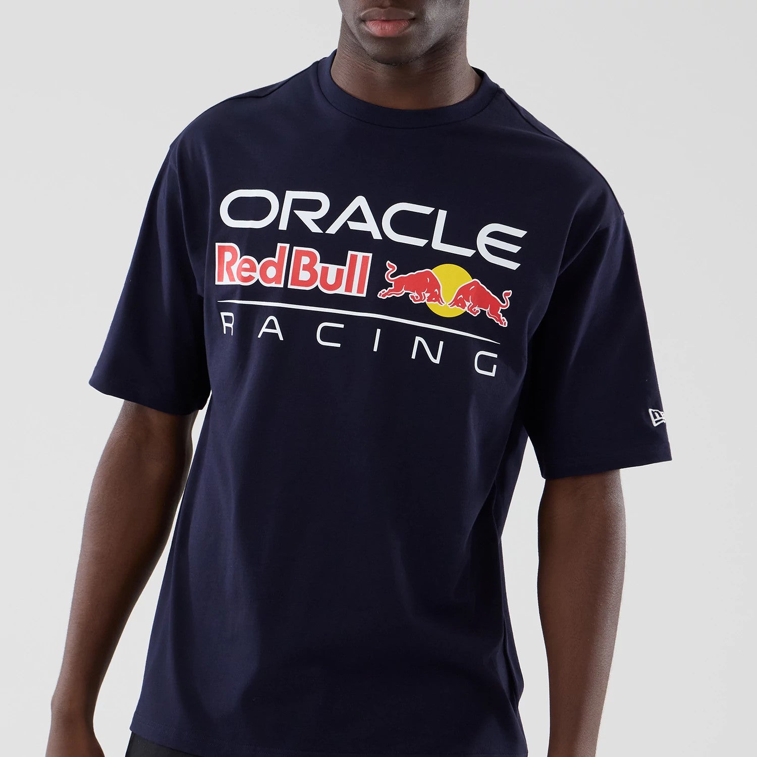 The model is wearing this Red Bull Racing Graphic Oversized T-Shirt in dark blue. 3