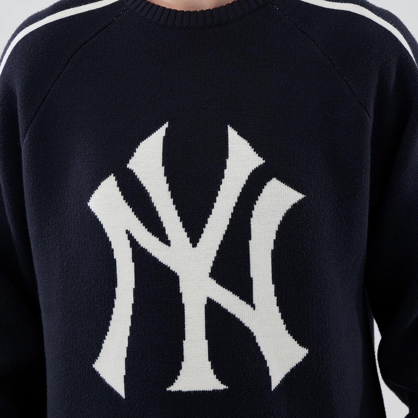 The model is wearing this MLB Knit New York Yankees Knitted Sweater in navy. 4