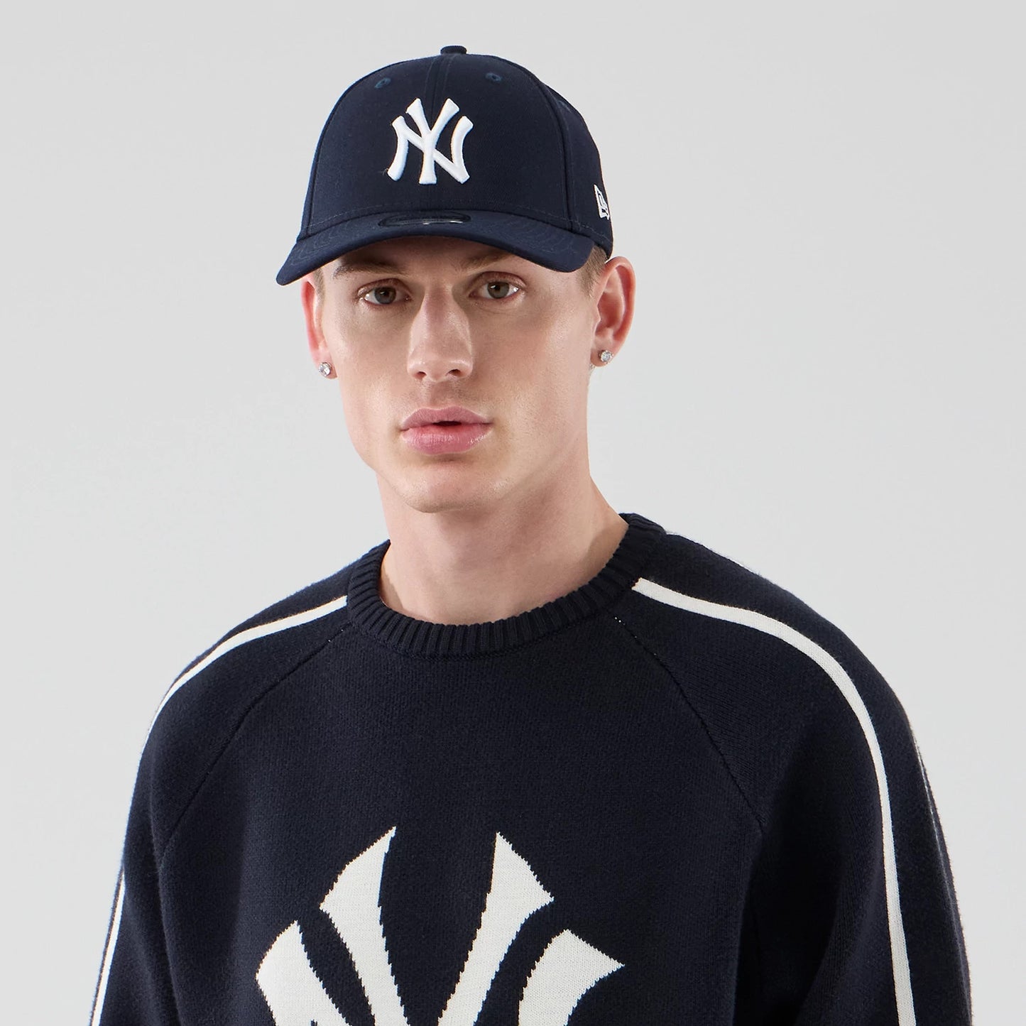 The model is wearing this MLB Knit New York Yankees Knitted Sweater in navy. 6