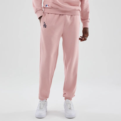 The model is wearing these MLB Midi League Essential LA Dodgers Joggers in pastel pink. 1