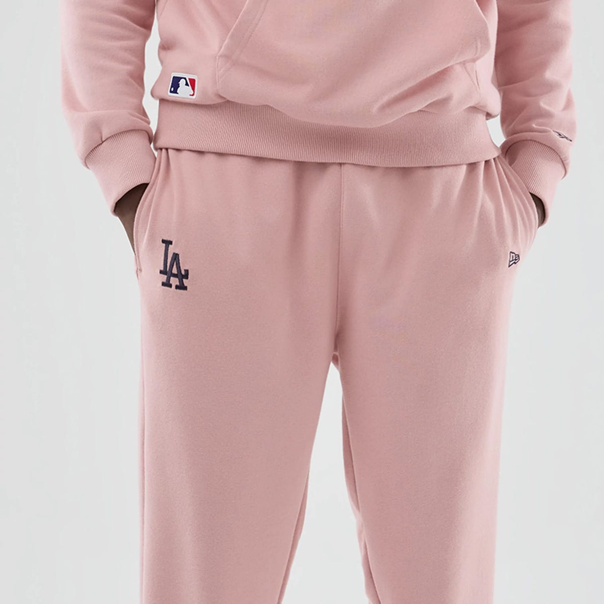 The model is wearing these MLB Midi League Essential LA Dodgers Joggers in pastel pink. 3