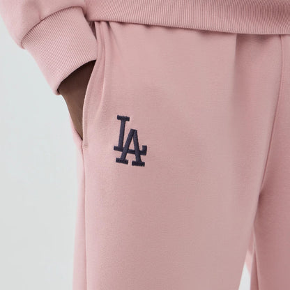 The model is wearing these MLB Midi League Essential LA Dodgers Joggers in pastel pink. 4