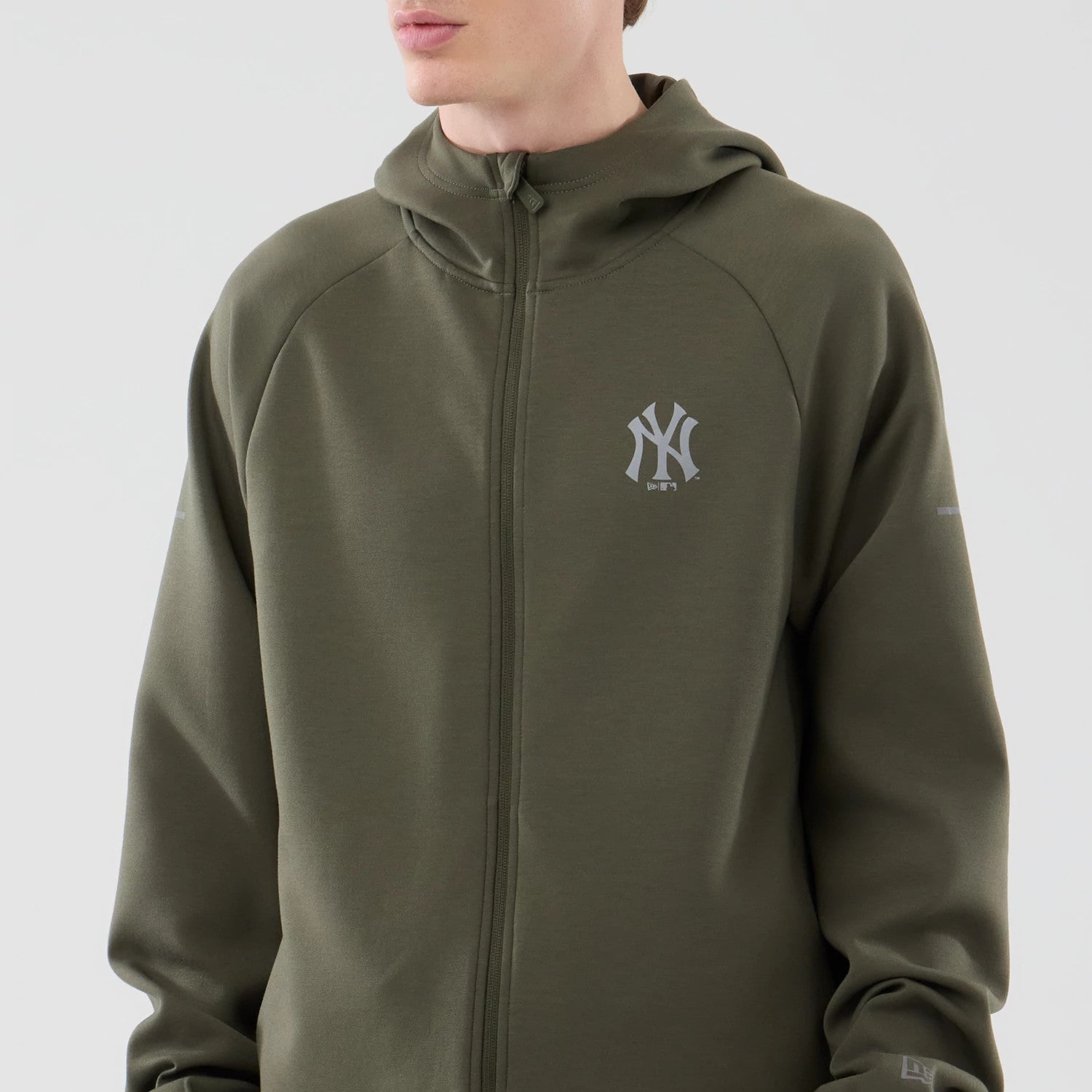 The model is wearing this MLB Core Plus New York Yankees Full Zip Hoodie in green. 3