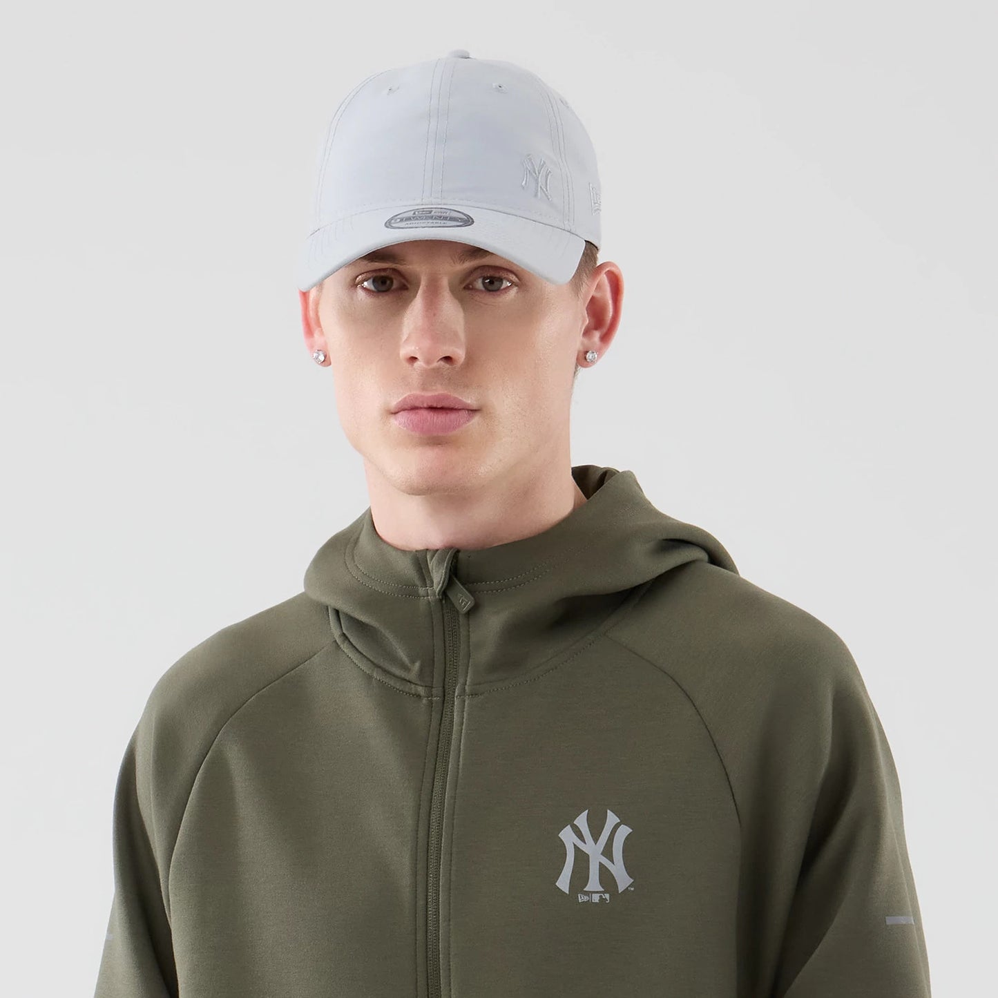 The model is wearing this MLB Core Plus New York Yankees Full Zip Hoodie in green. 6