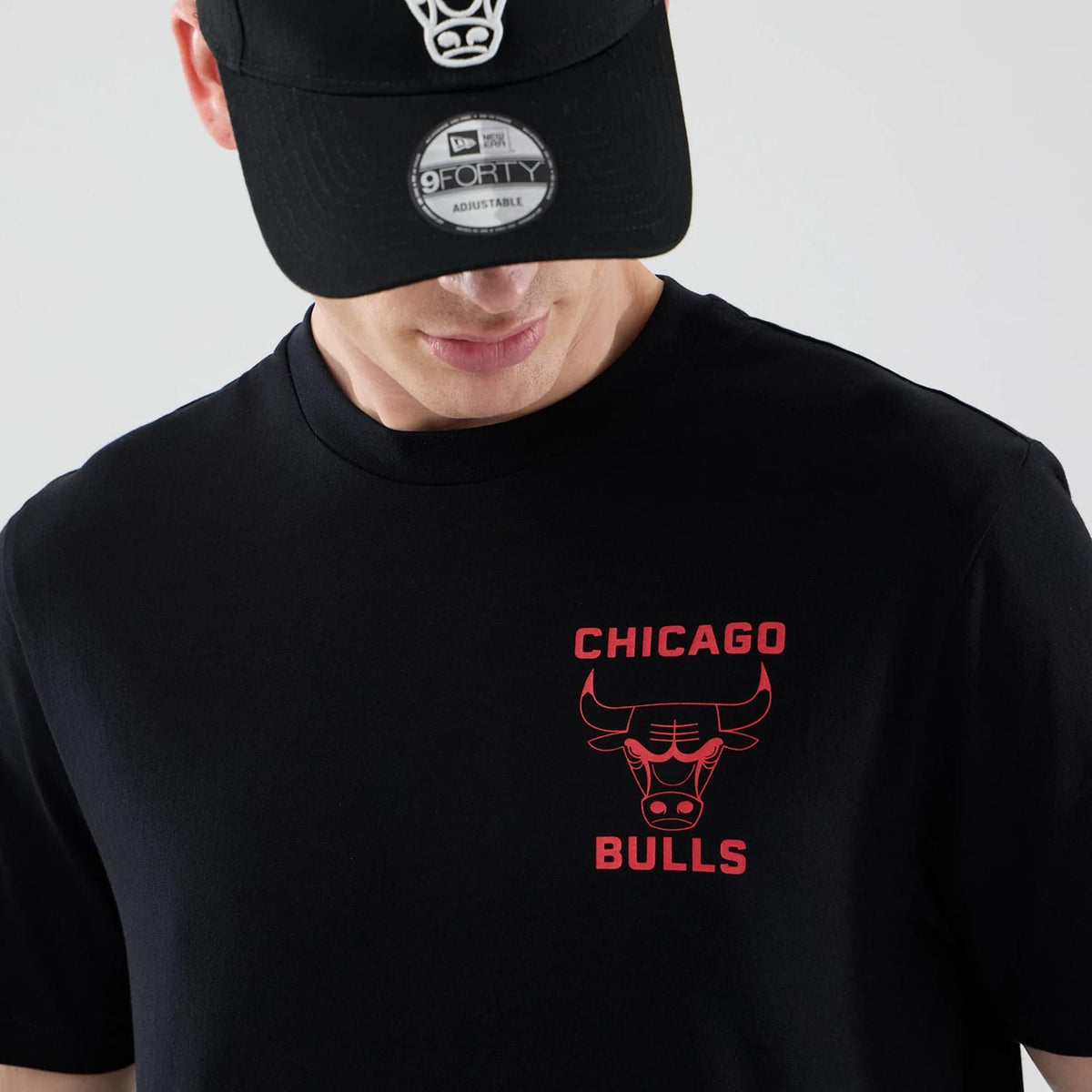 The model is wearing this NBA Court Graphic Chicago Bulls T-Shirt in black. 6