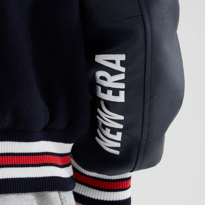 The model is wearing this Red Bull Racing wordmark Varsity Jacket in dark blue. 6