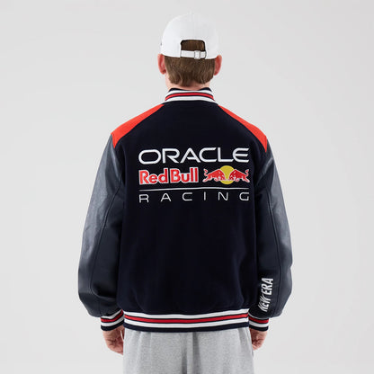 The model is wearing this Red Bull Racing wordmark Varsity Jacket in dark blue. 2