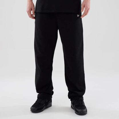 The model is wearing these New Era Tech Reflective Straight Leg Joggers in black. 1