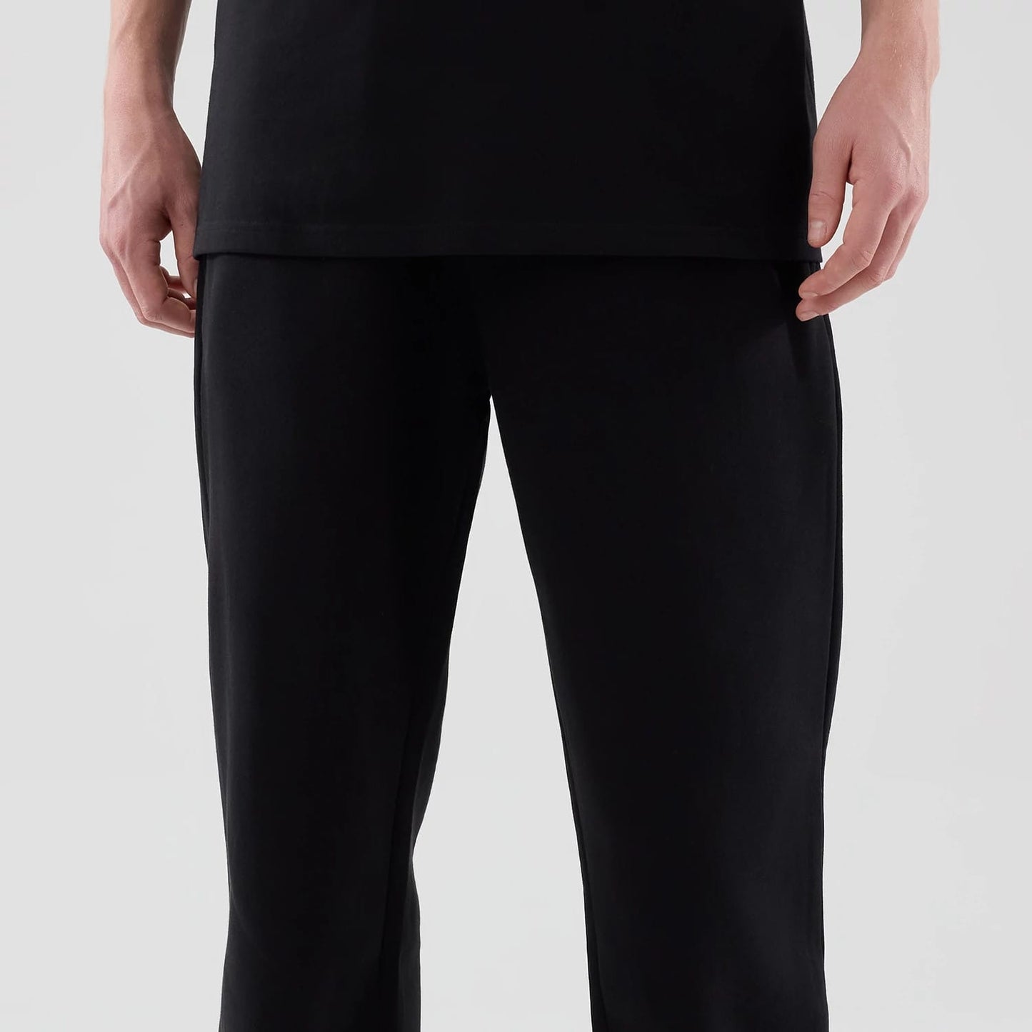 The model is wearing these New Era Tech Straight Leg Joggers in black. 3