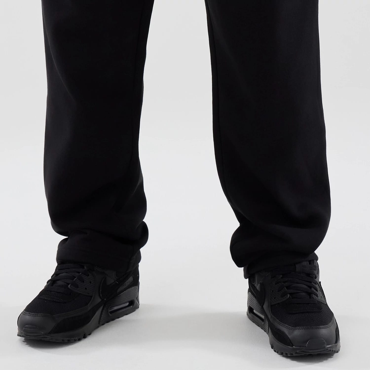 The model is wearing these New Era Tech Straight Leg Joggers in black. 6