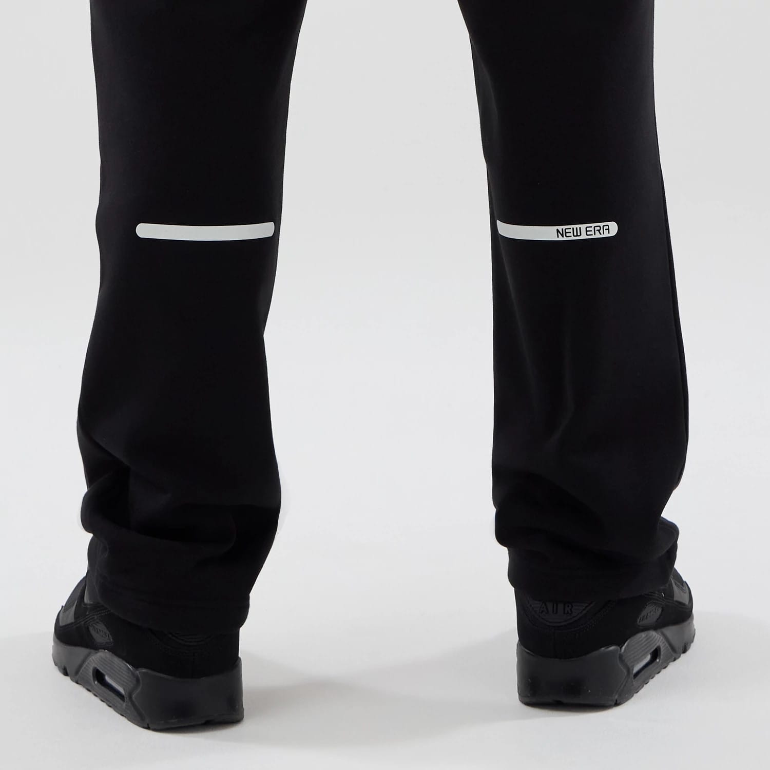 The model is wearing these New Era Tech Straight Leg Joggers in black. 7