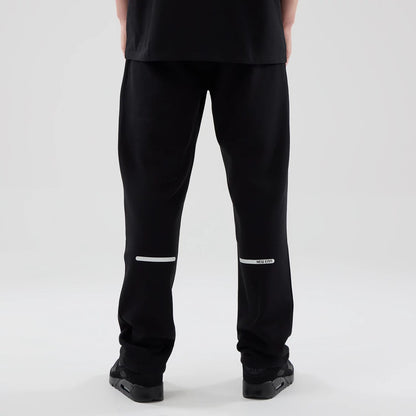 The model is wearing these New Era Tech Straight Leg Joggers in black. 2