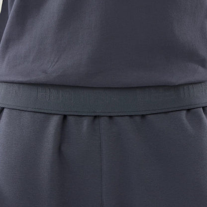 The model is wearing these New Era Tech Straight Leg Joggers in grey. 4