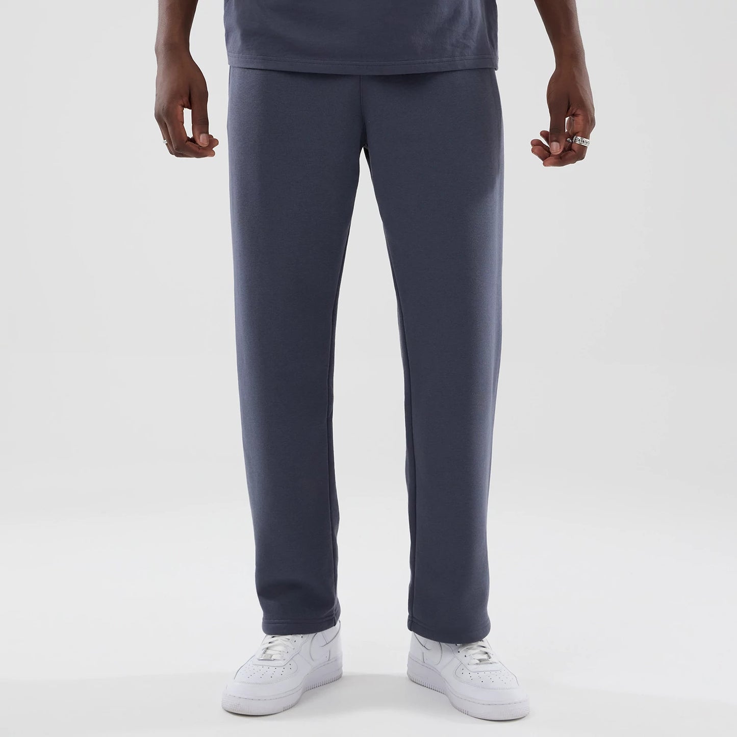 The model is wearing these New Era Tech Straight Leg Joggers in grey. 1
