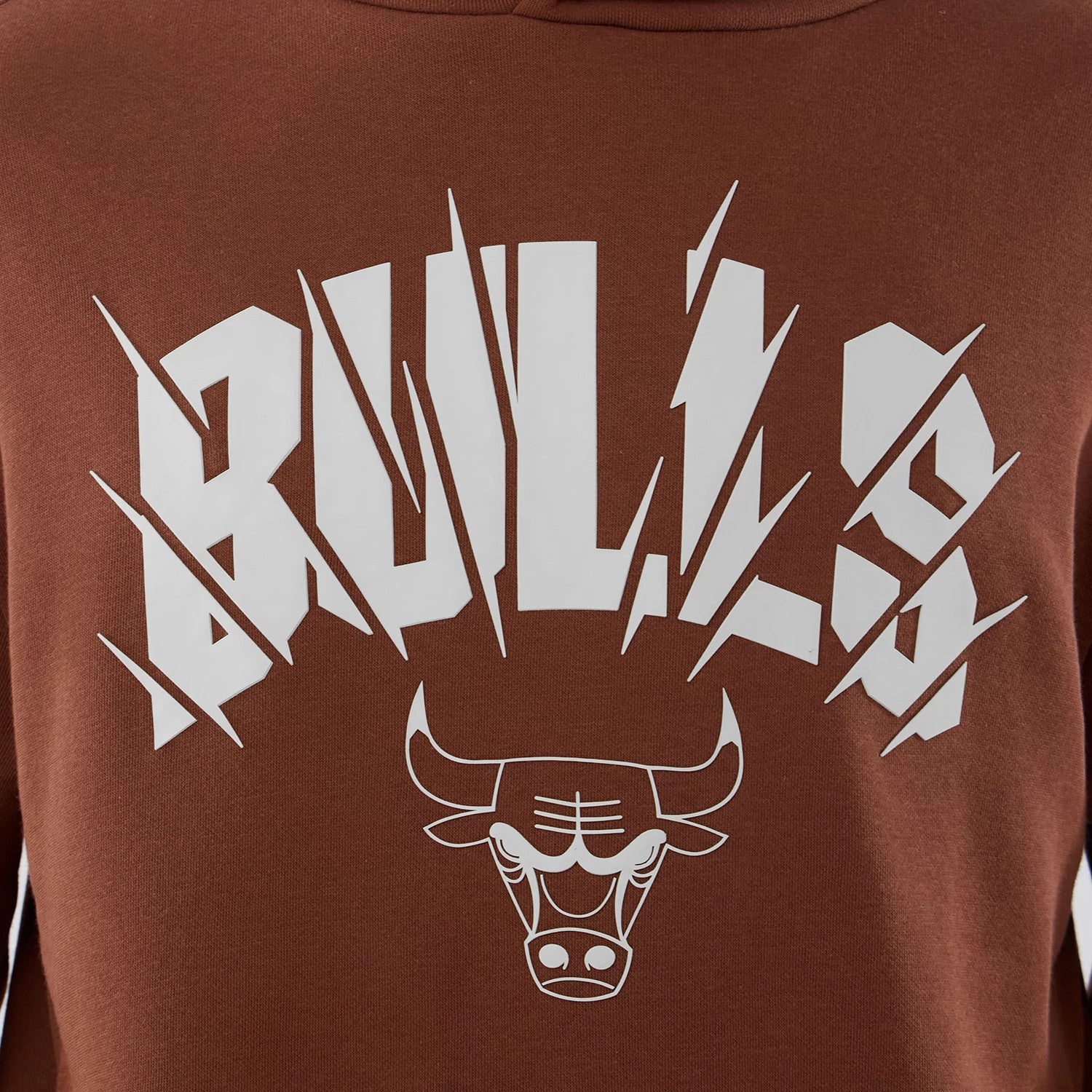 The model is wearing this NBA Core Plus Chicago Bulls Pullover Hoodie in brown. 4