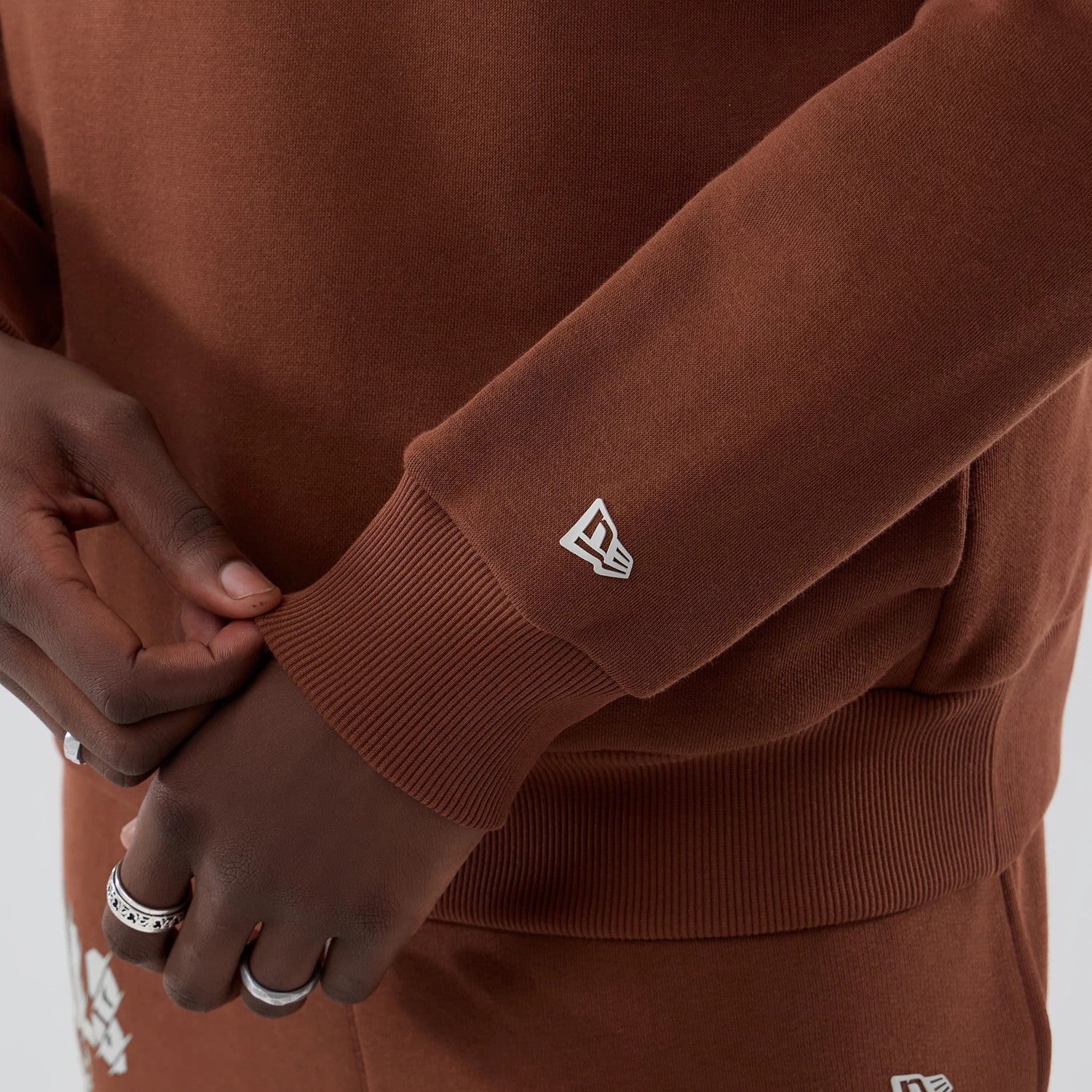 The model is wearing this NBA Core Plus Chicago Bulls Pullover Hoodie in brown. 6